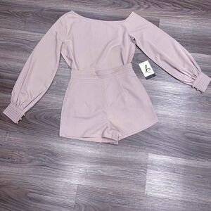 ong-sleeved off-the-shoulder shirt.